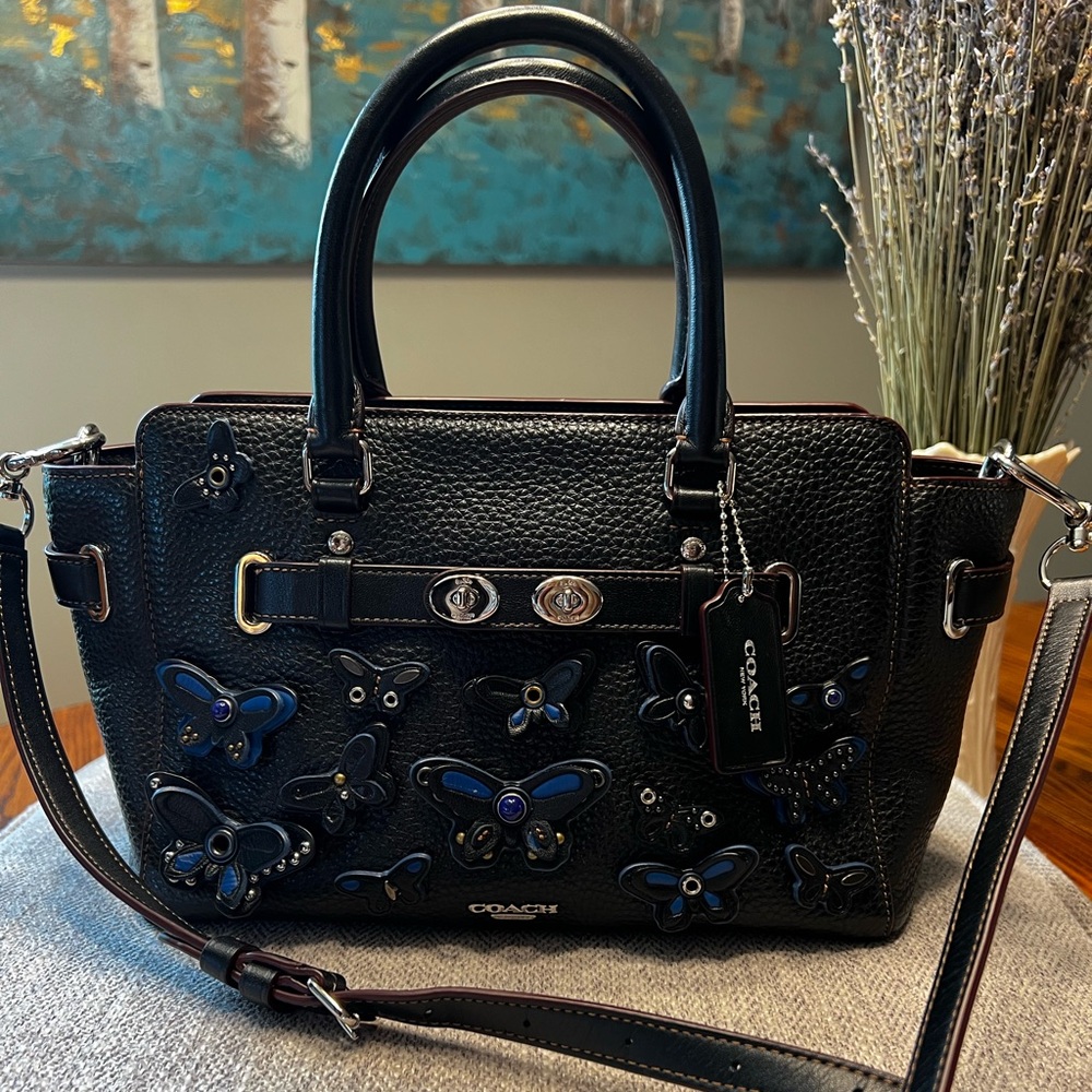 Rare Coach pebble leather Blake carryall with butterfly appliqué.